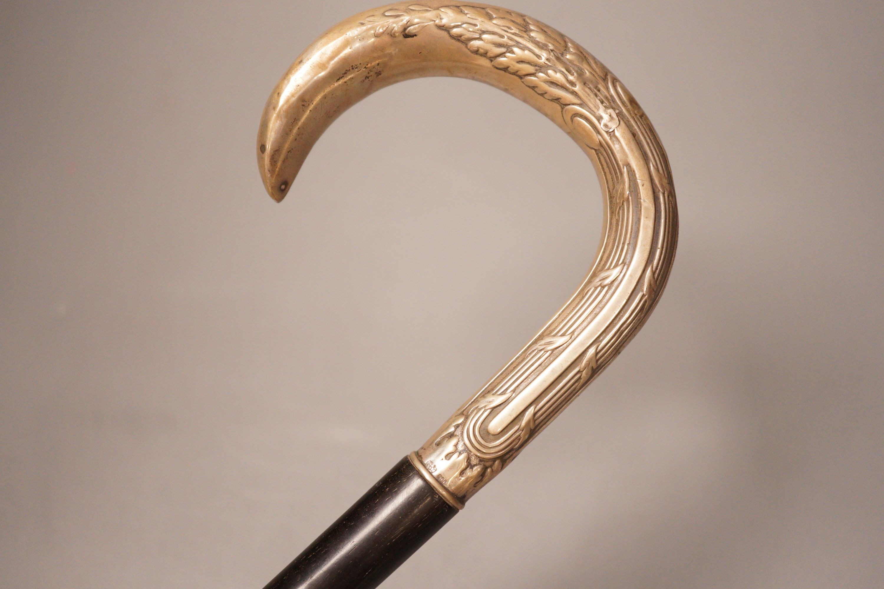 An 800 stamped white metal handled walking stick, 93cm long